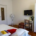 Aconchego De Quartos No Centro De